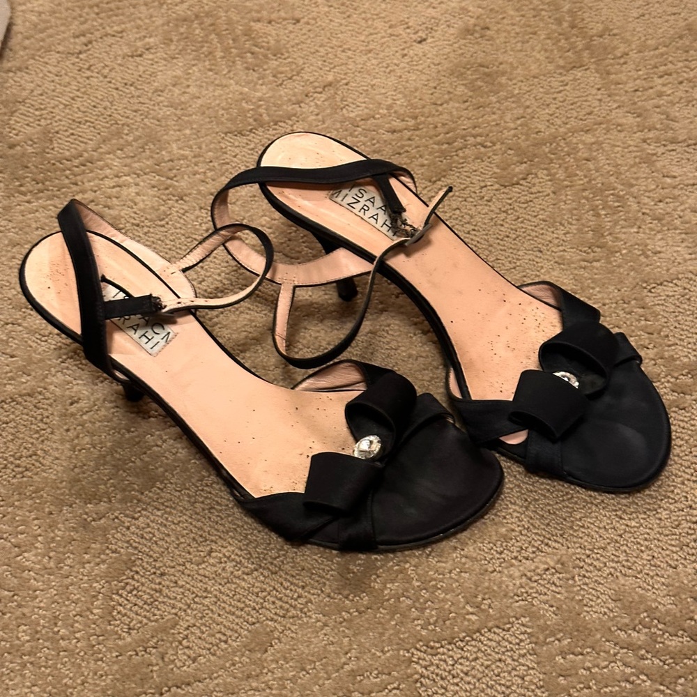 Black heels with bow detail and crystal in front